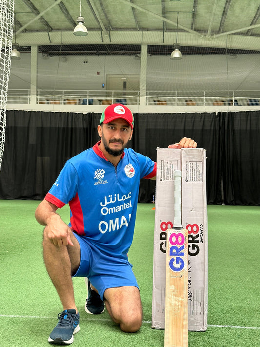 Triumph bat with Oman Captain ICC team